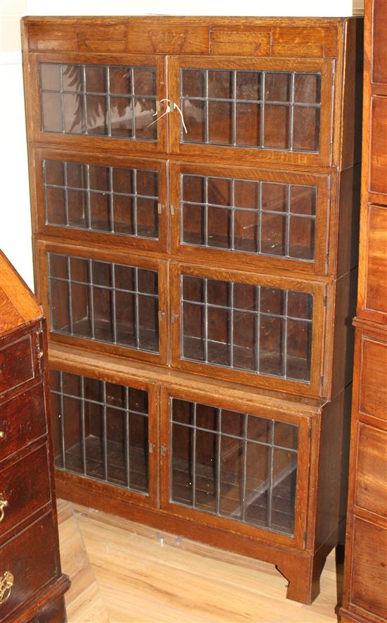 A Minty, Oxford oak four-tier Globe Wernicke style bookcase W.89cm